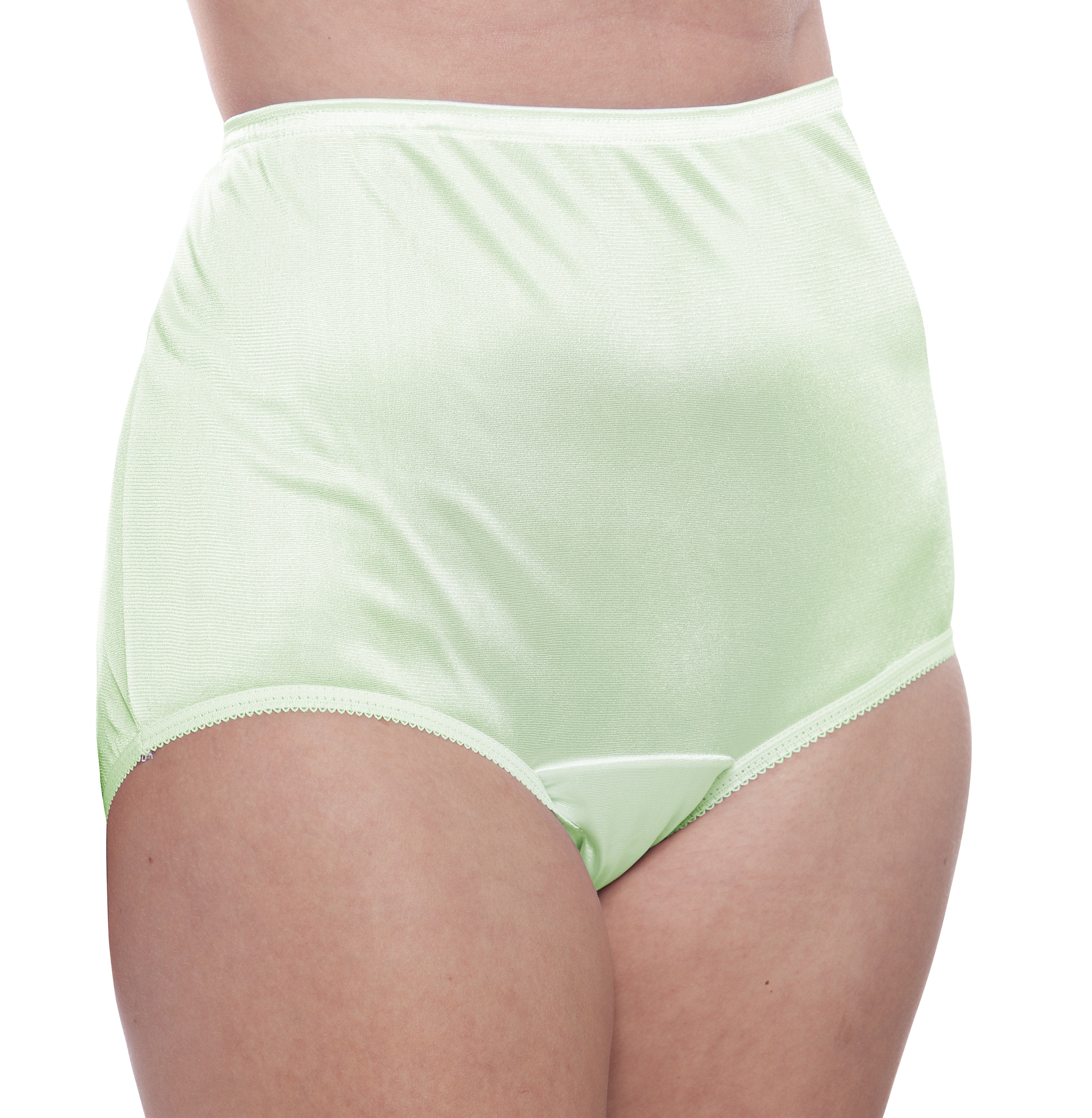 A person wears Teri Lingerie’s Nylon Brief Panty (Style 331/Plain Jane) in Classic Lights—a high-waisted, light green satin panty—shown waist to upper thighs against a white background. Sold as a 4 pack.