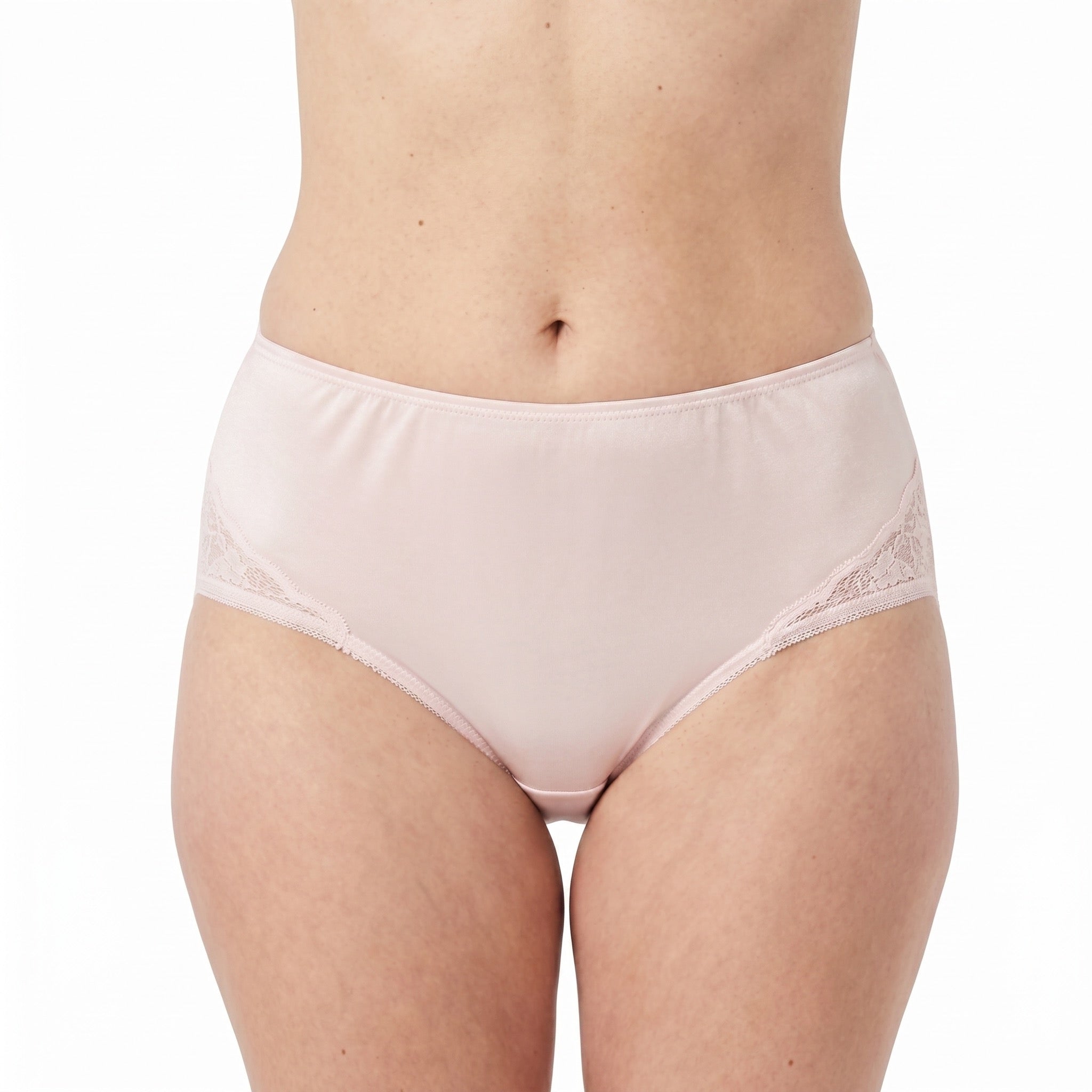 A model wears Teri Lingerie's Nylon and Lace Brief Panty (Style M108/Beatrice) 3 Pack in Light Pink, featuring high-waisted feminine design with lace side details, shown from waist to upper thighs against a white background.