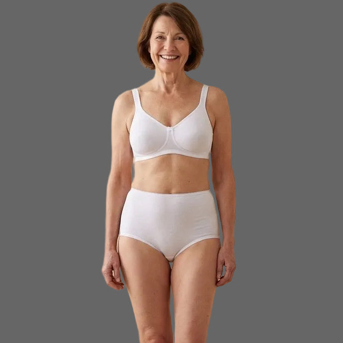 Woman wearing a white bra and 118 style panties.